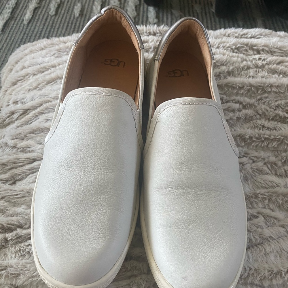 Never worn Ugg slip on shoes.